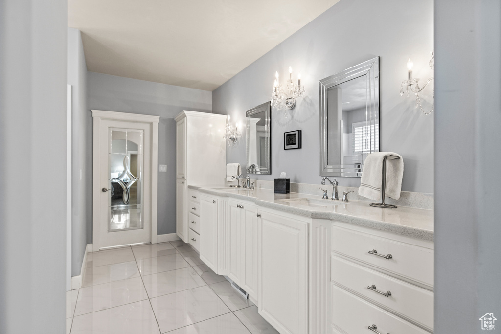 Bathroom with tile patterned flooring and vanity