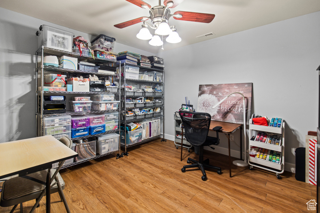 Office area featuring ceiling fan and wood-type flooring