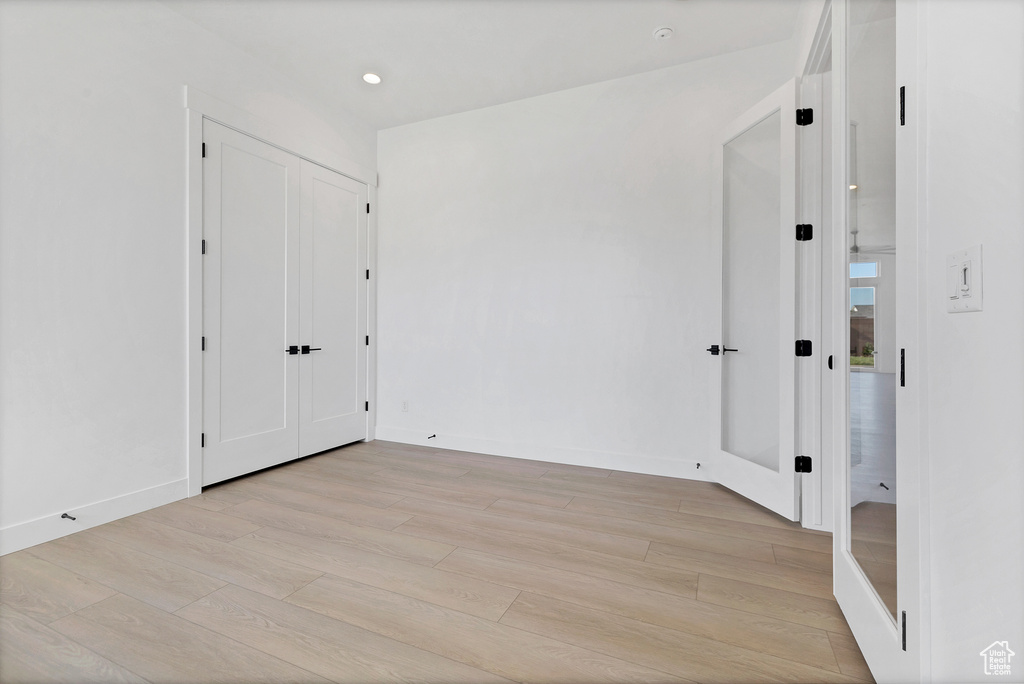Spare room featuring light wood-style floors and recessed lighting