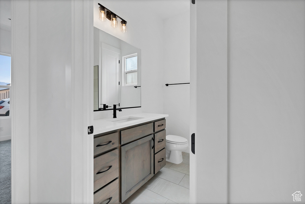 Bathroom with healthy amount of natural light and vanity