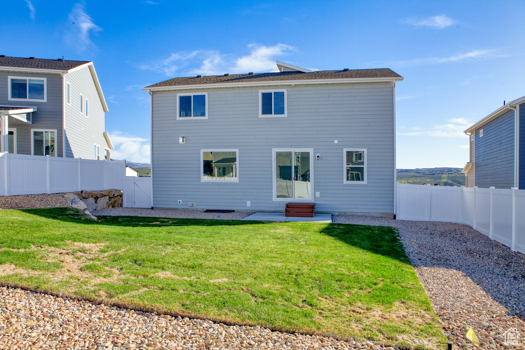 Back of house featuring entry steps and a patio area