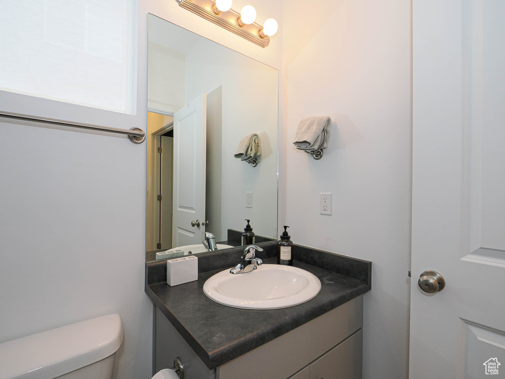 Bathroom featuring vanity and toilet