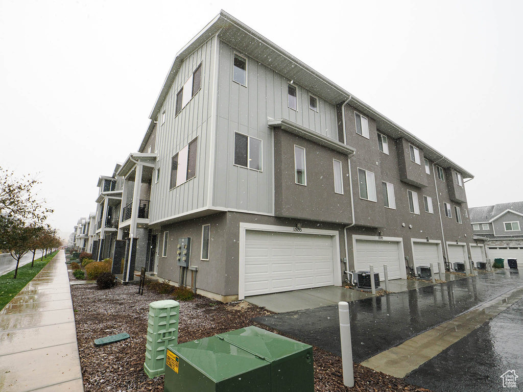 View of property with a garage