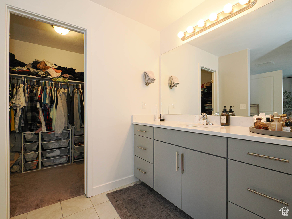 Bathroom featuring vanity and tile patterned floors