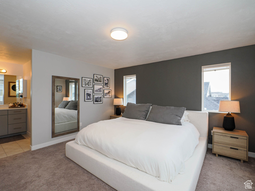 Carpeted bedroom with ensuite bath