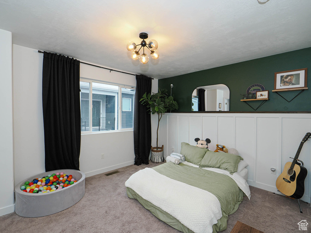 Bedroom with light colored carpet