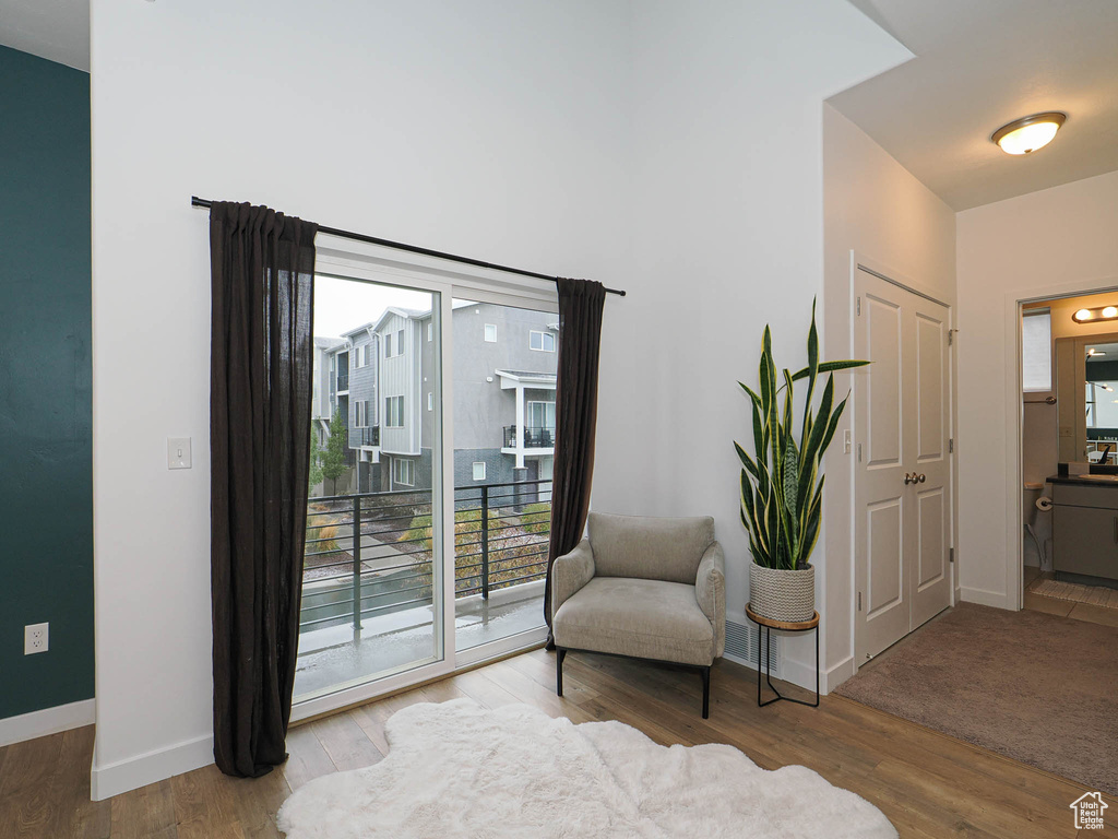 Sitting room with wood-type flooring