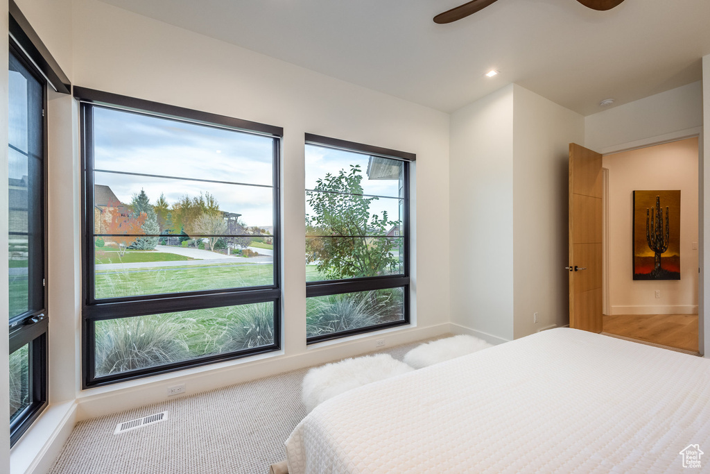 Bedroom with carpet flooring and ceiling fan