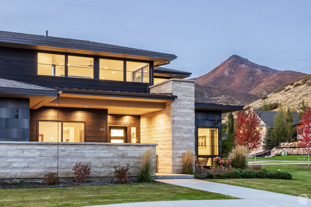 View of front of property with a mountain view