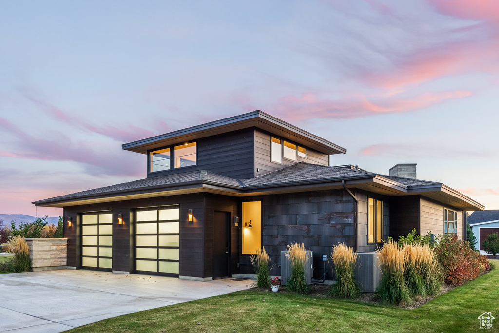 Prairie-style home featuring a yard