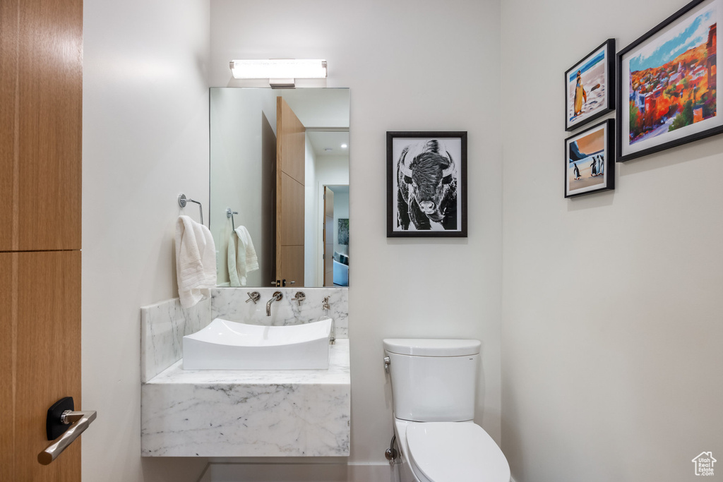 Bathroom featuring sink and toilet