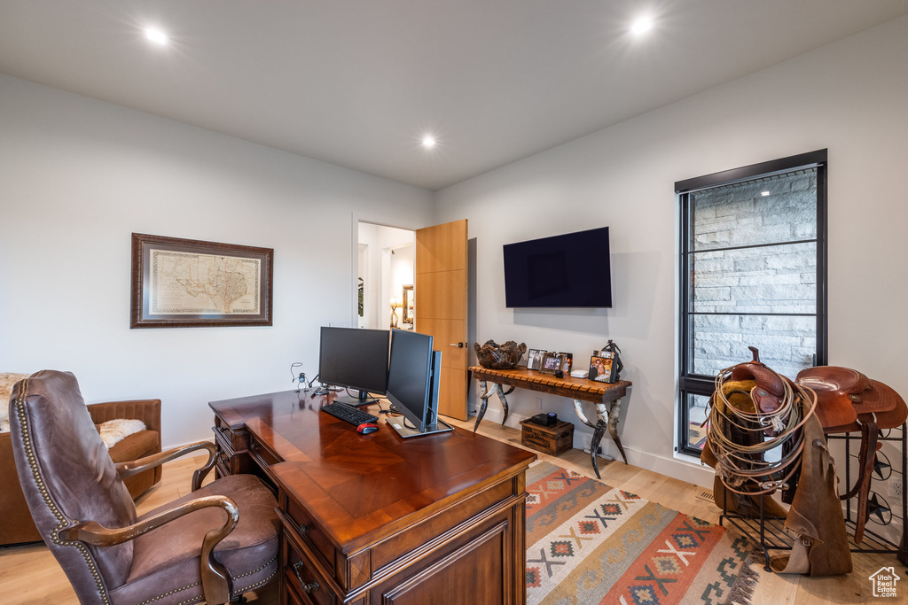 Office with light wood-type flooring