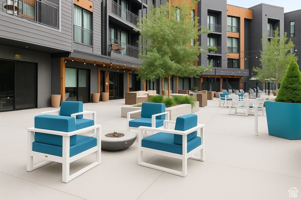 View of patio / terrace featuring an outdoor living space with a fire pit
