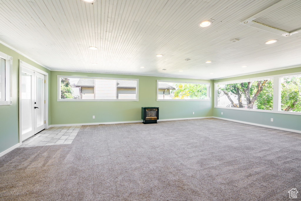 Unfurnished living room with light colored carpet