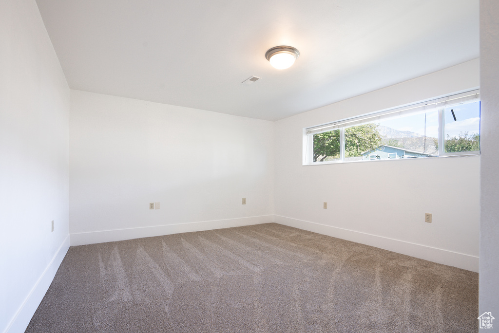 View of carpeted spare room