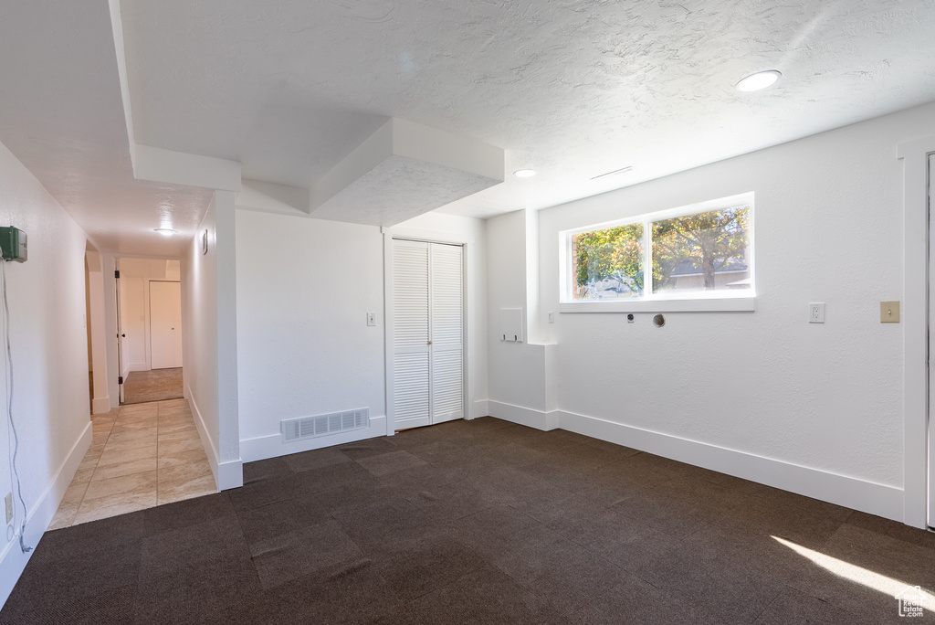 Unfurnished room with carpet floors