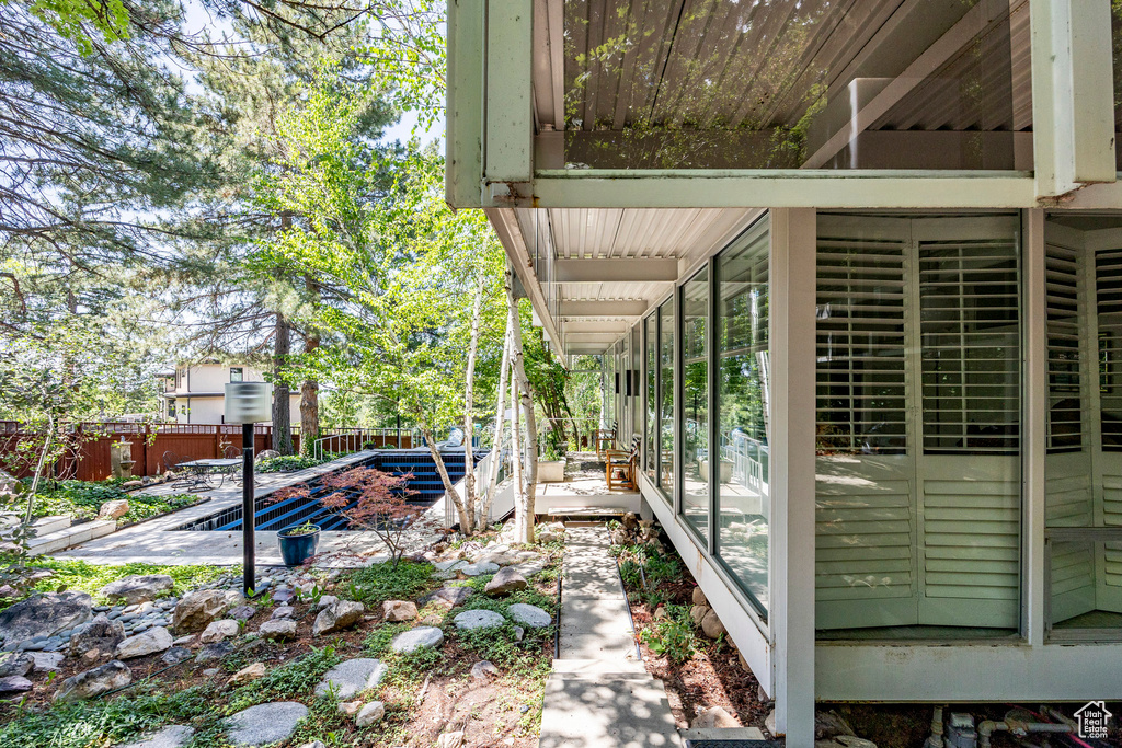 View of side of home featuring a patio area