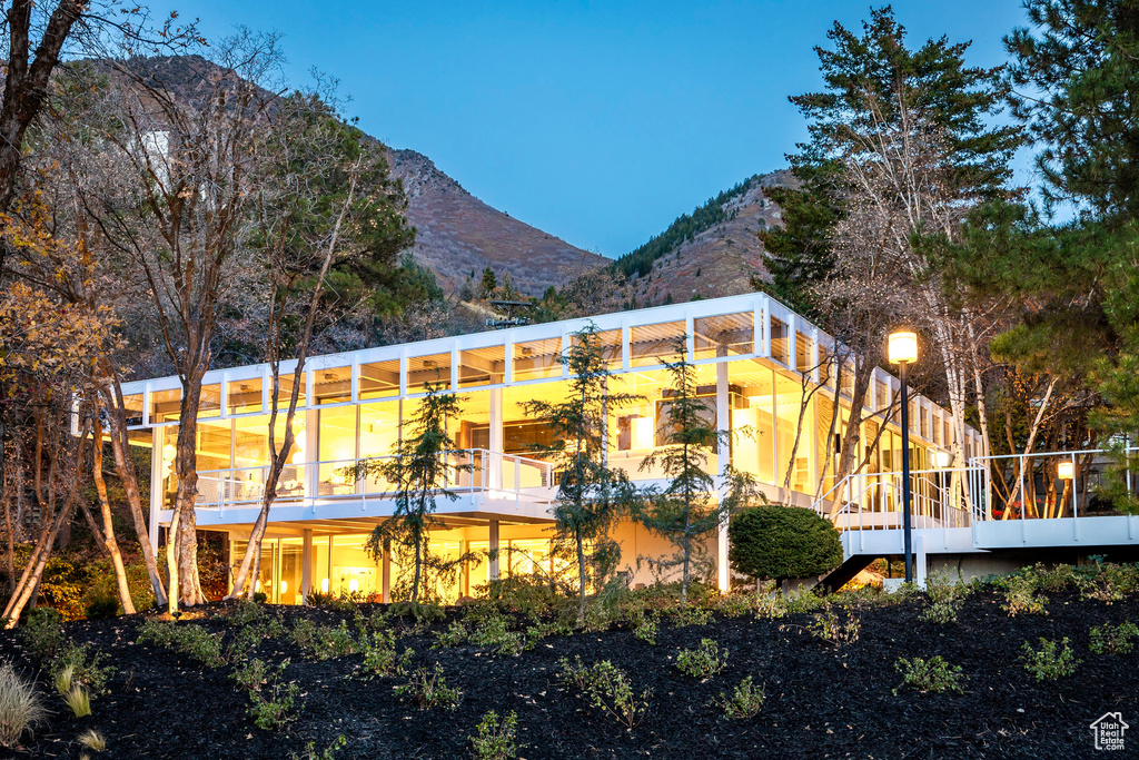 Rear view of property with a mountain view