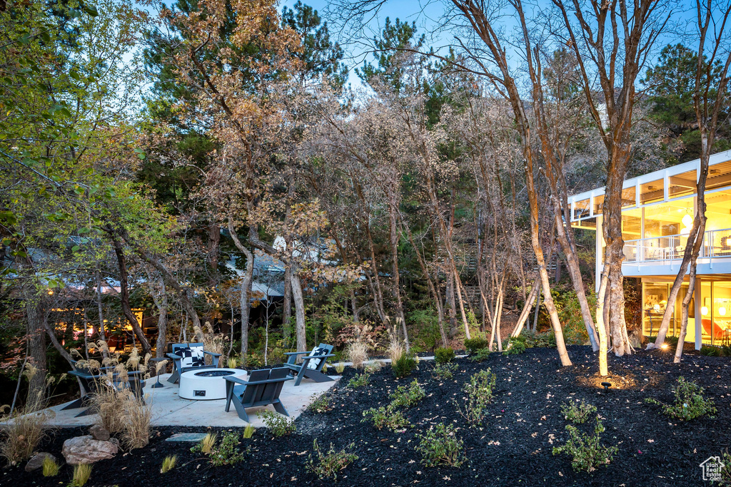 View of yard featuring a patio area and a fire pit