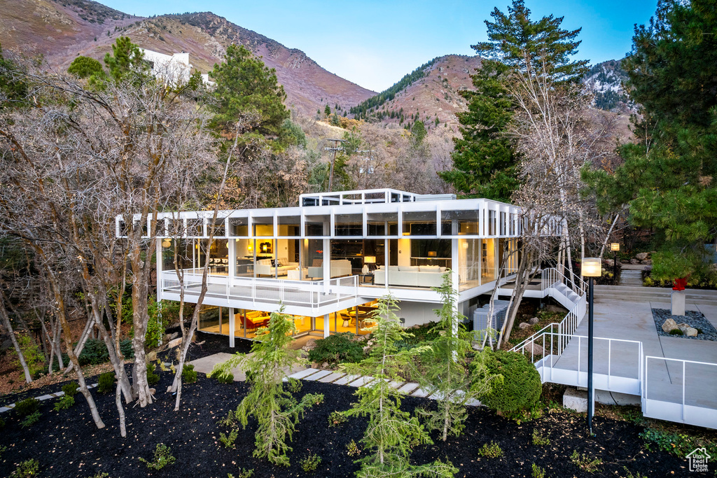 Back of property featuring a mountain view