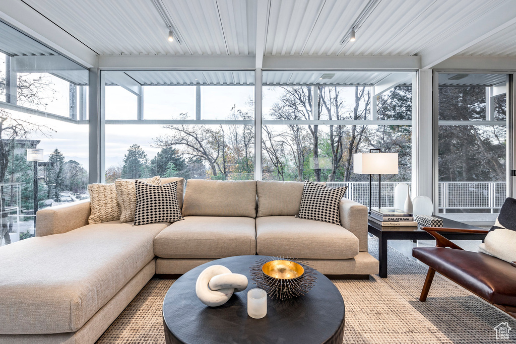 Sunroom / solarium featuring a healthy amount of sunlight