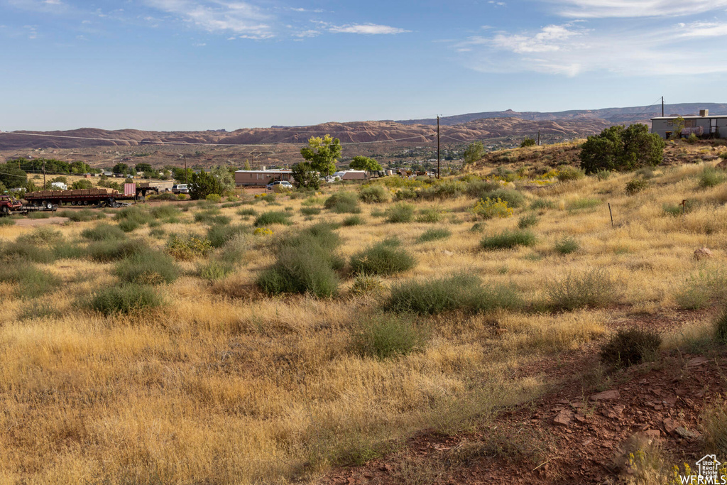 Property view of mountains with a rural view