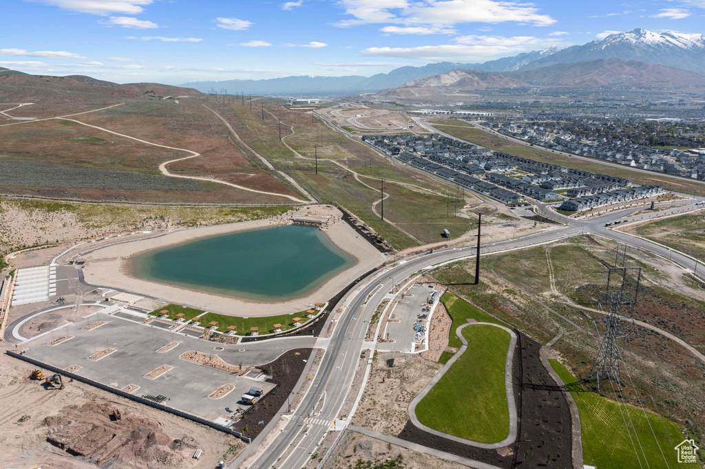 Birds eye view of property featuring a water and mountain view