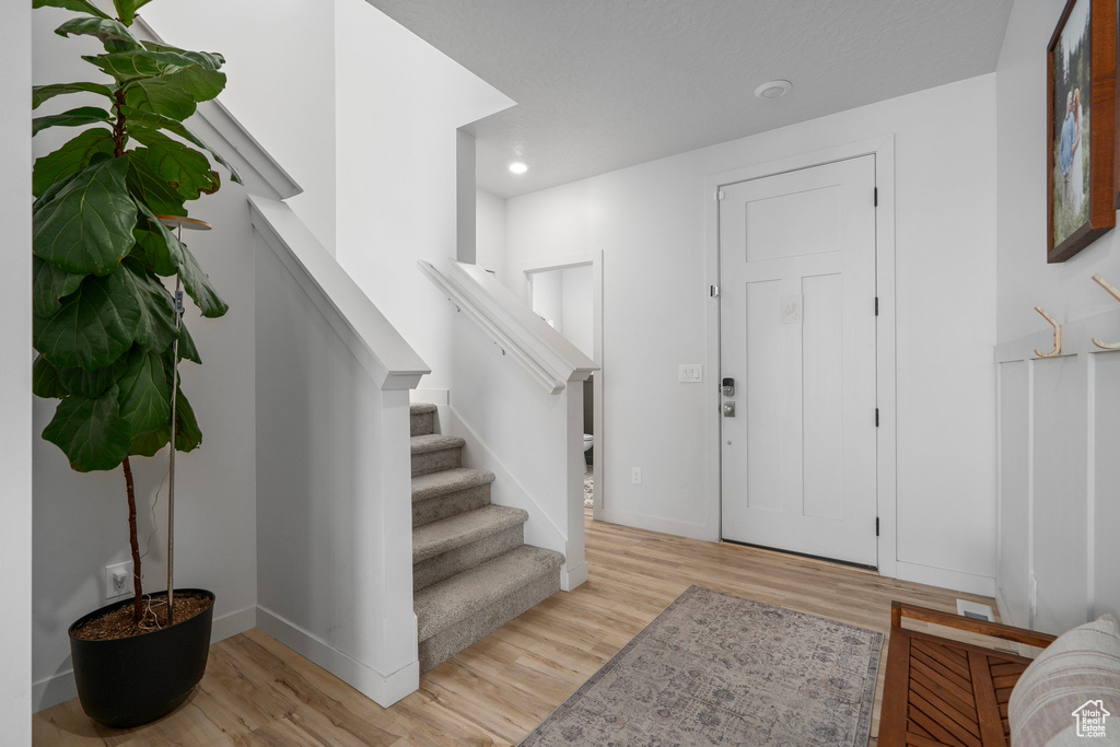 Foyer entrance featuring light hardwood / wood-style flooring