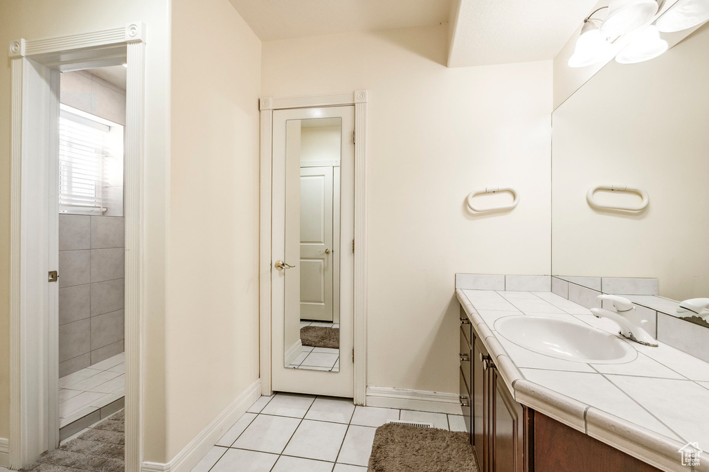 Bathroom featuring vanity and tile patterned floors