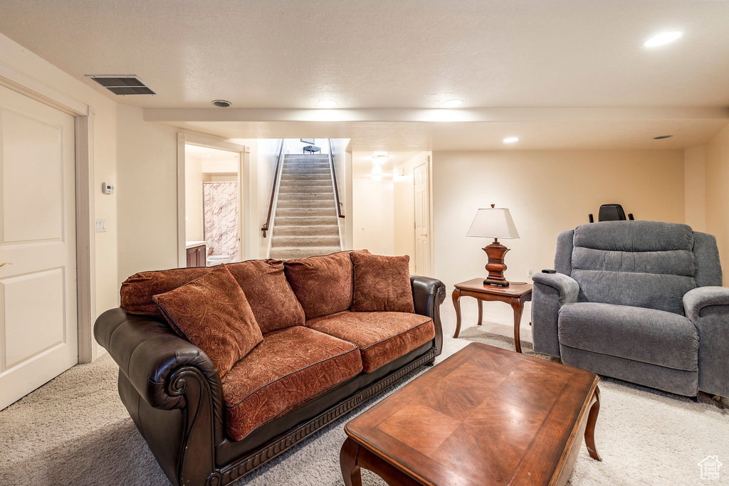 Living room featuring light colored carpet