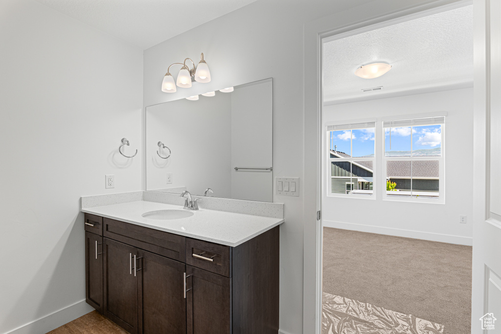 Bathroom with vanity and baseboards