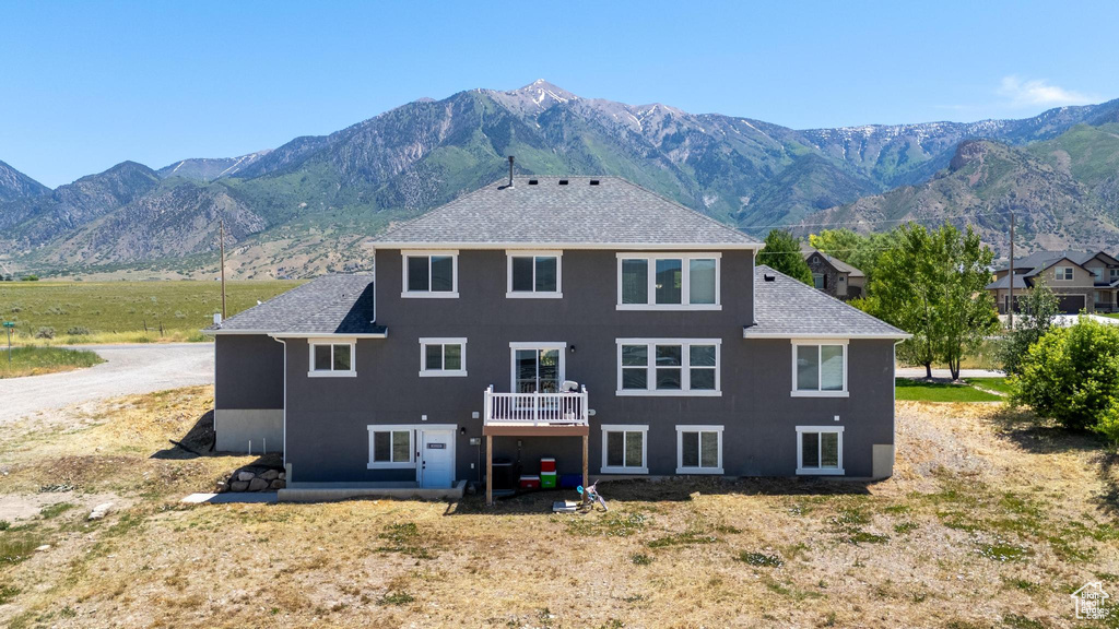 Rear view of property featuring a mountain view