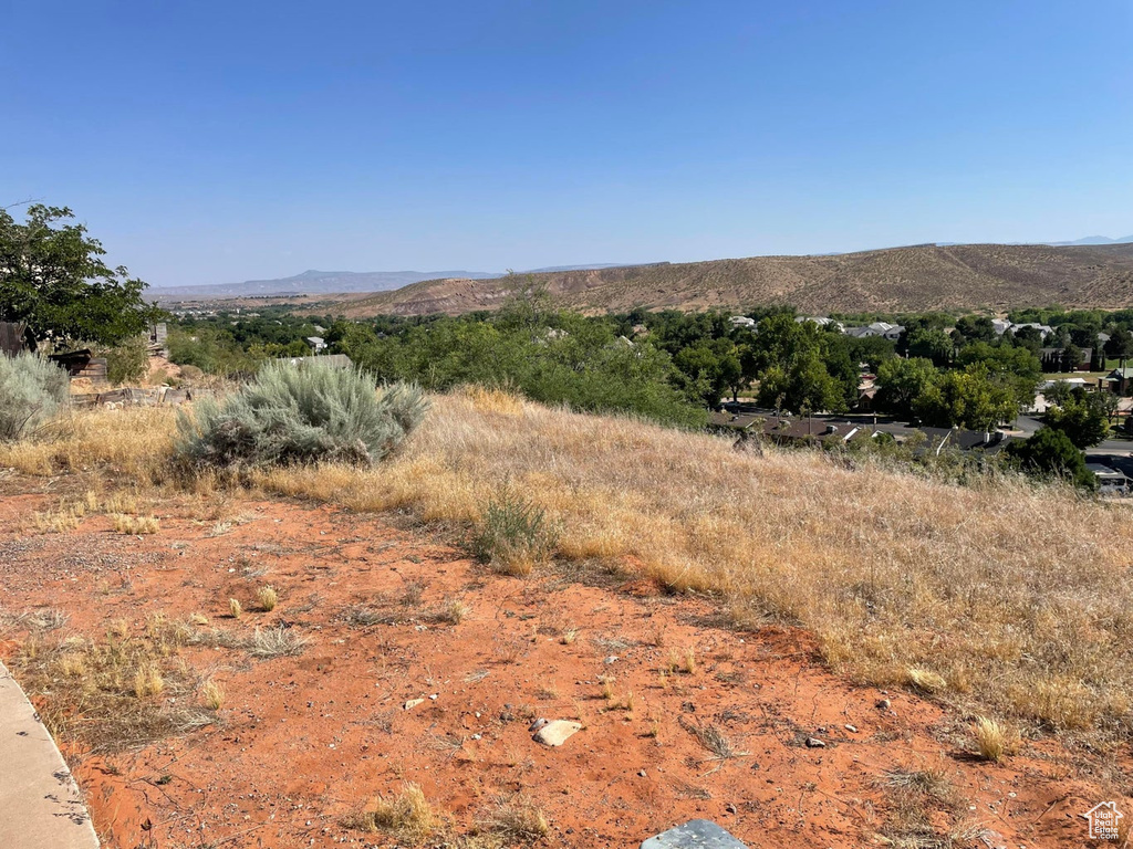 Property view of mountains with a rural view