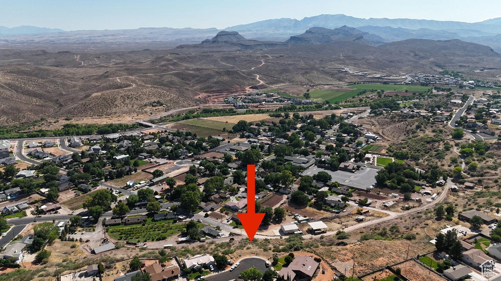 Birds eye view of property with a mountain view