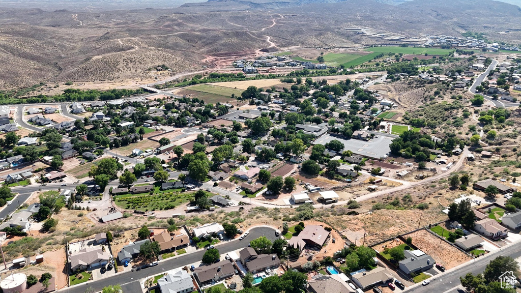 Birds eye view of property with a mountain view