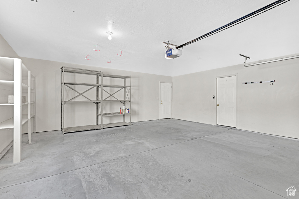 Garage featuring a garage door opener