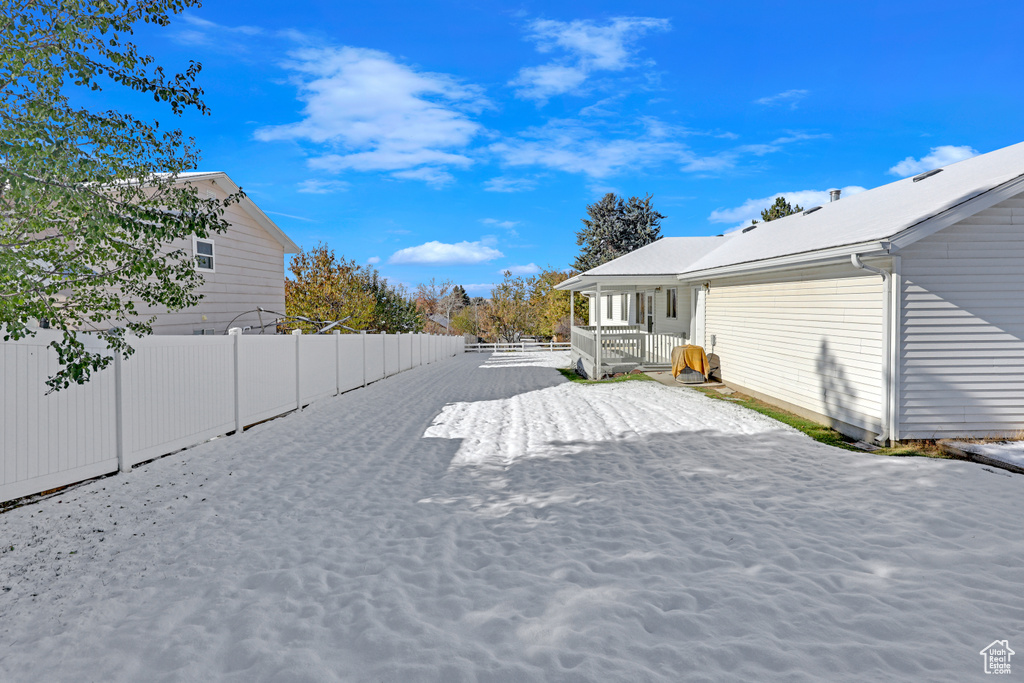 View of yard with covered porch