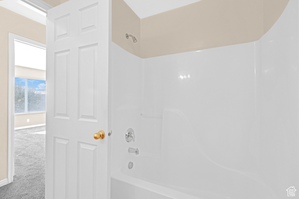 Bathroom featuring washtub / shower combination