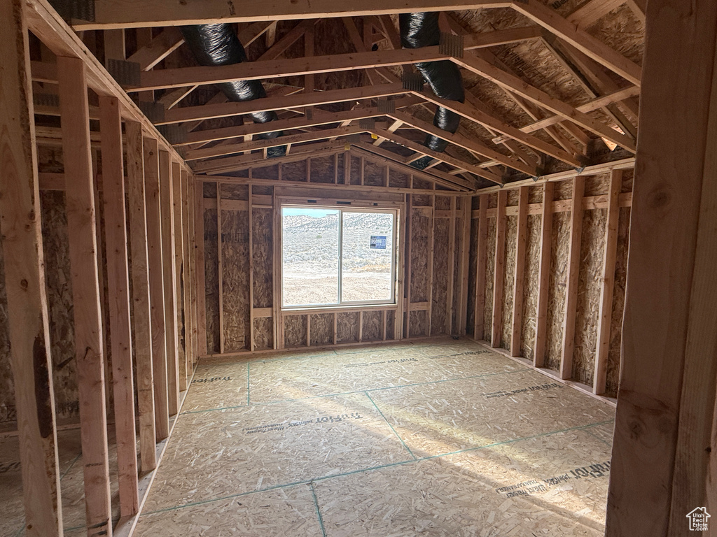 Miscellaneous room featuring lofted ceiling