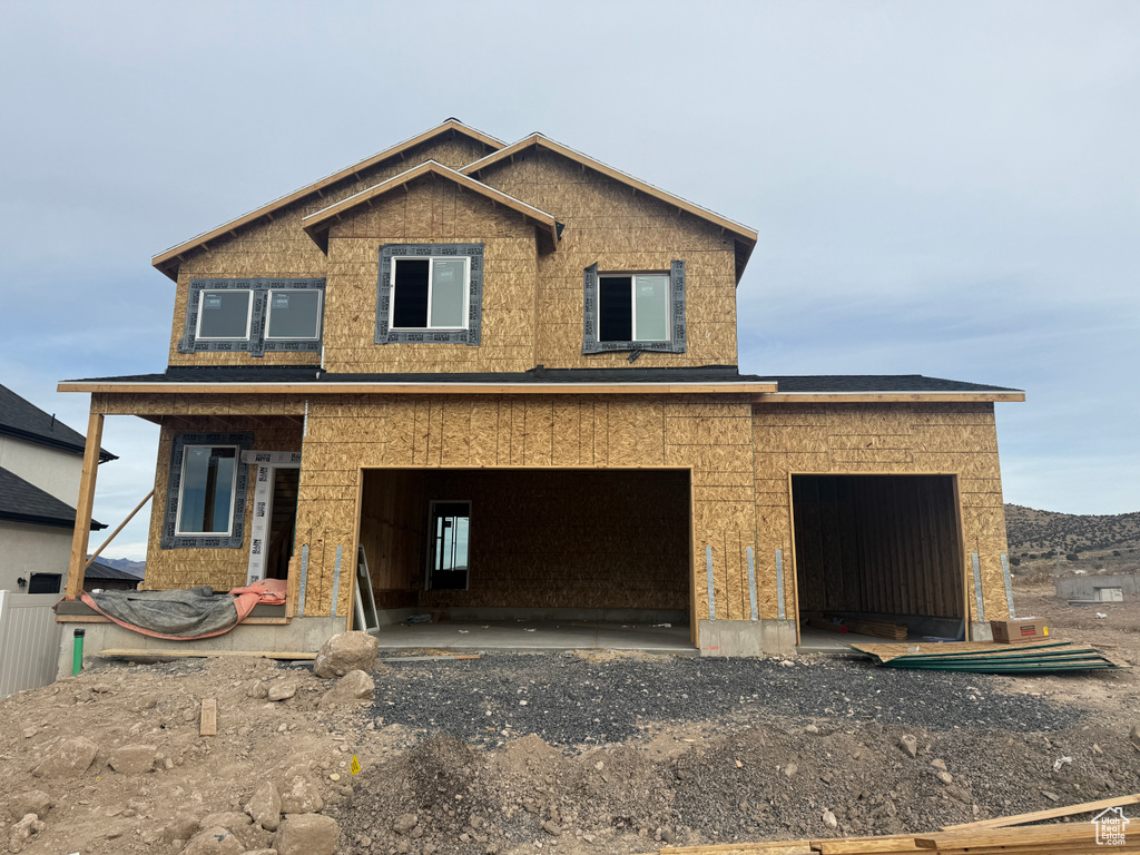 Property under construction with a garage