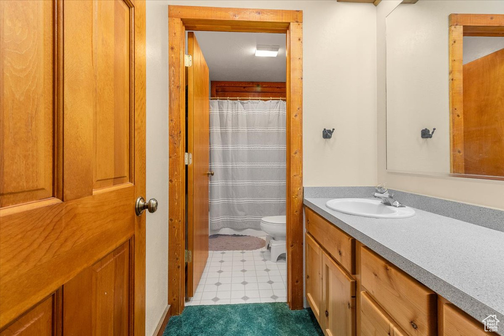 Bathroom with vanity and toilet