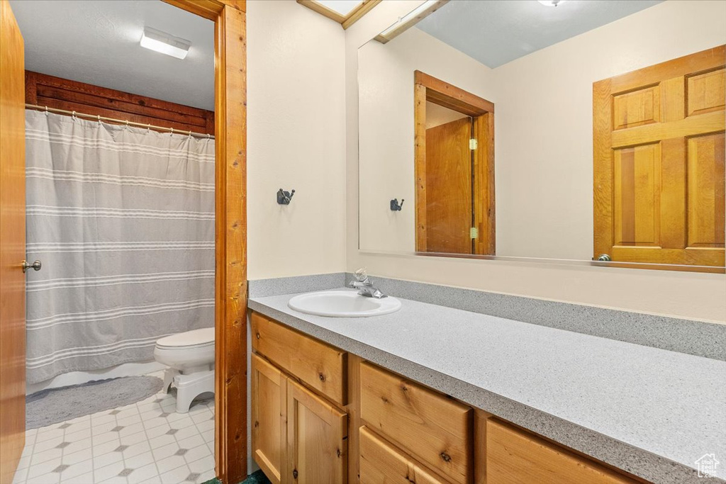 Bathroom featuring vanity and toilet