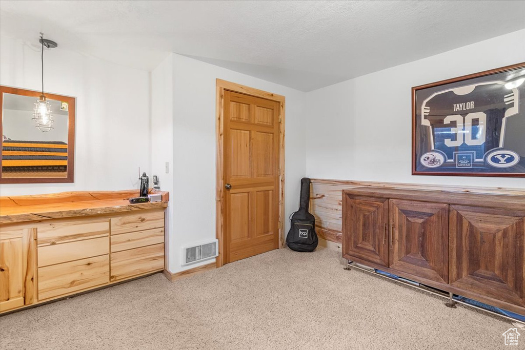 Interior space featuring light colored carpet