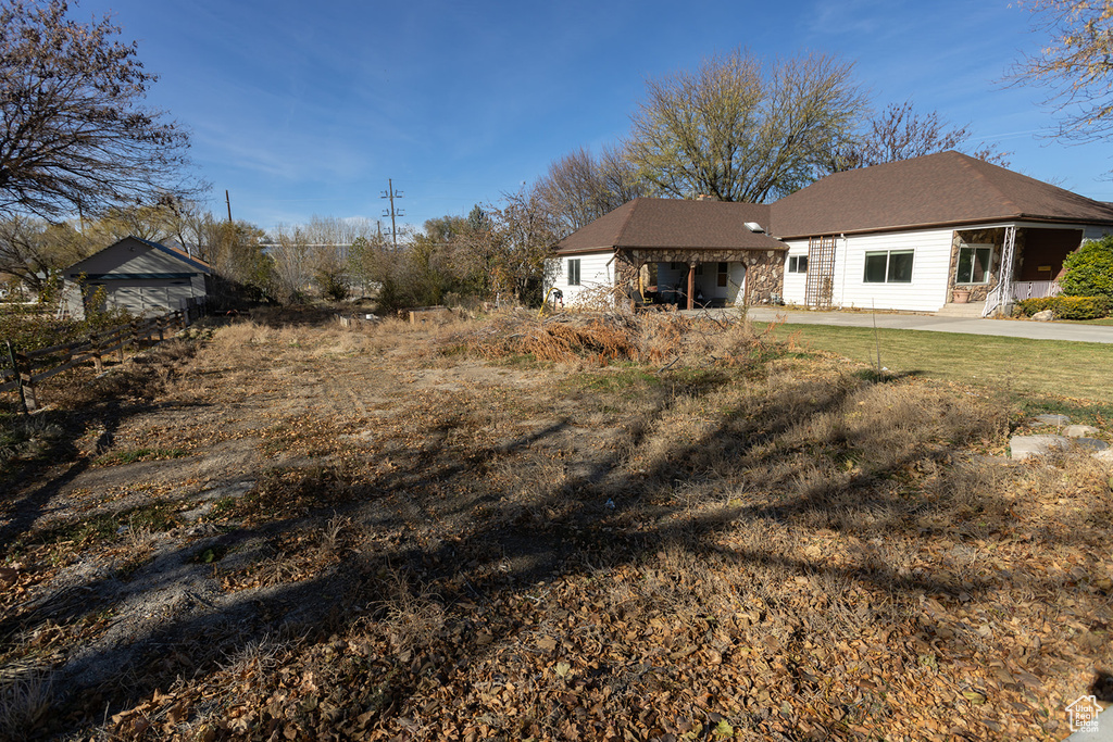 Back of property featuring a lawn