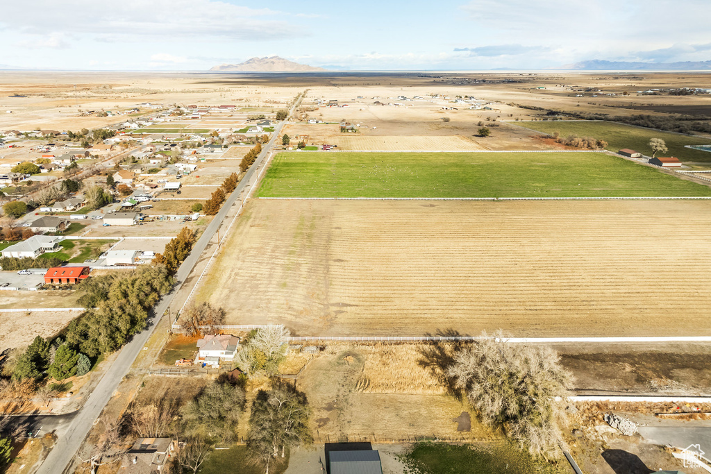 Aerial overview of property's location with rural landscape and a mountain backdrop