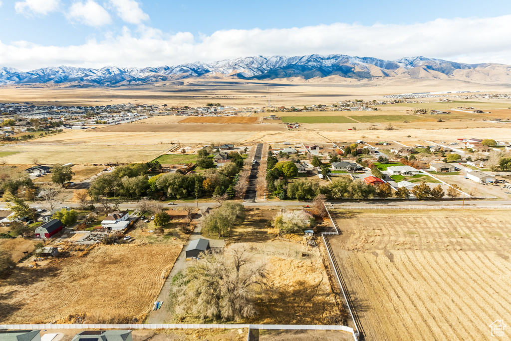 Aerial view of sparsely populated area featuring a mountainous background