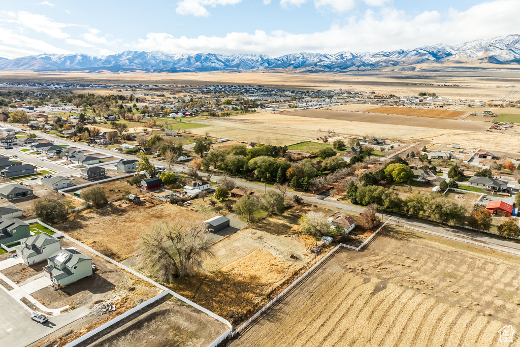 Aerial view of sparsely populated area featuring a mountainous background