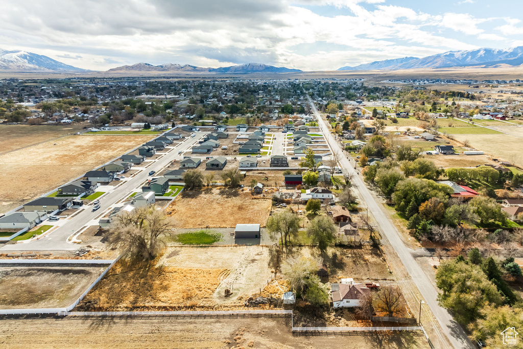 Aerial view of residential area featuring a mountainous background