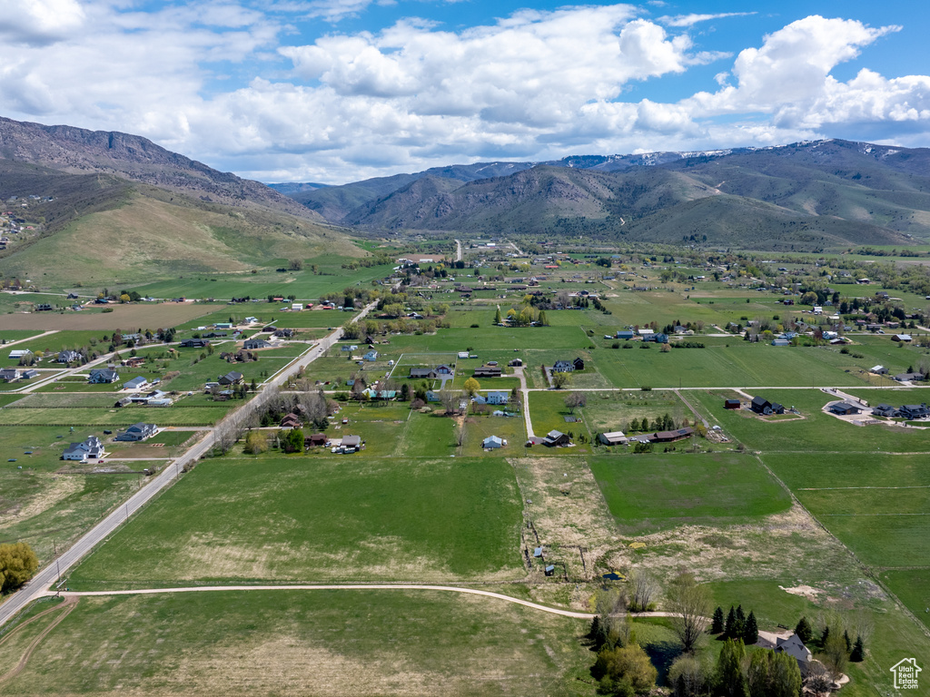 Birds eye view of property with a mountain view and a rural view