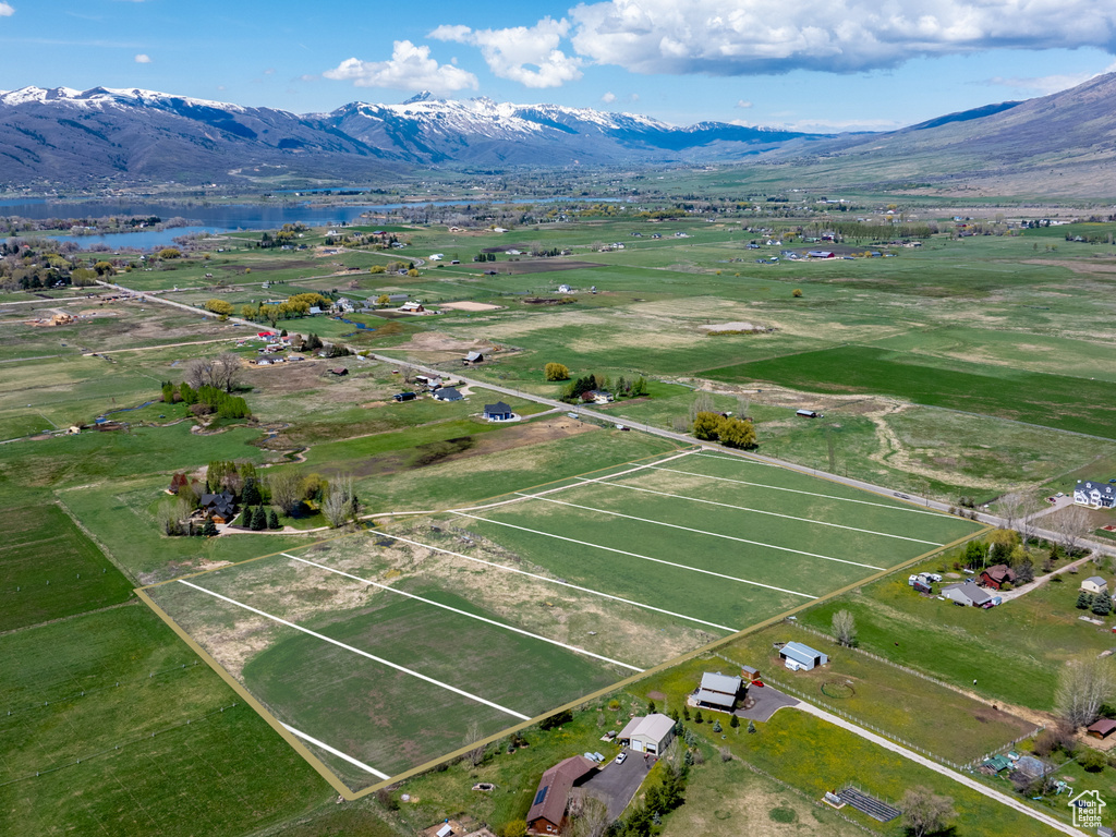 Aerial view featuring a water and mountain view